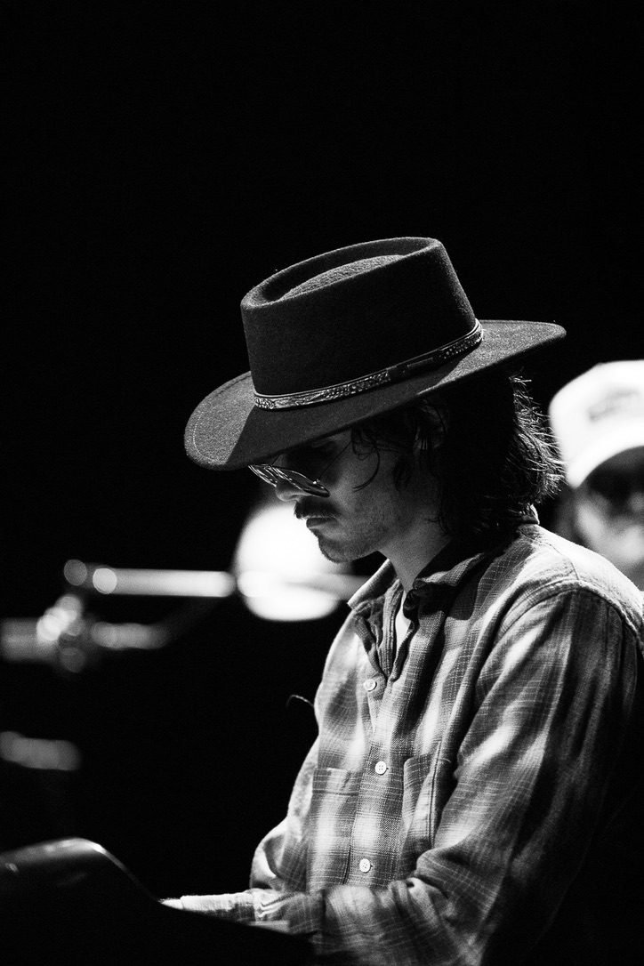Black and white profile of Finn Dickens in a hat