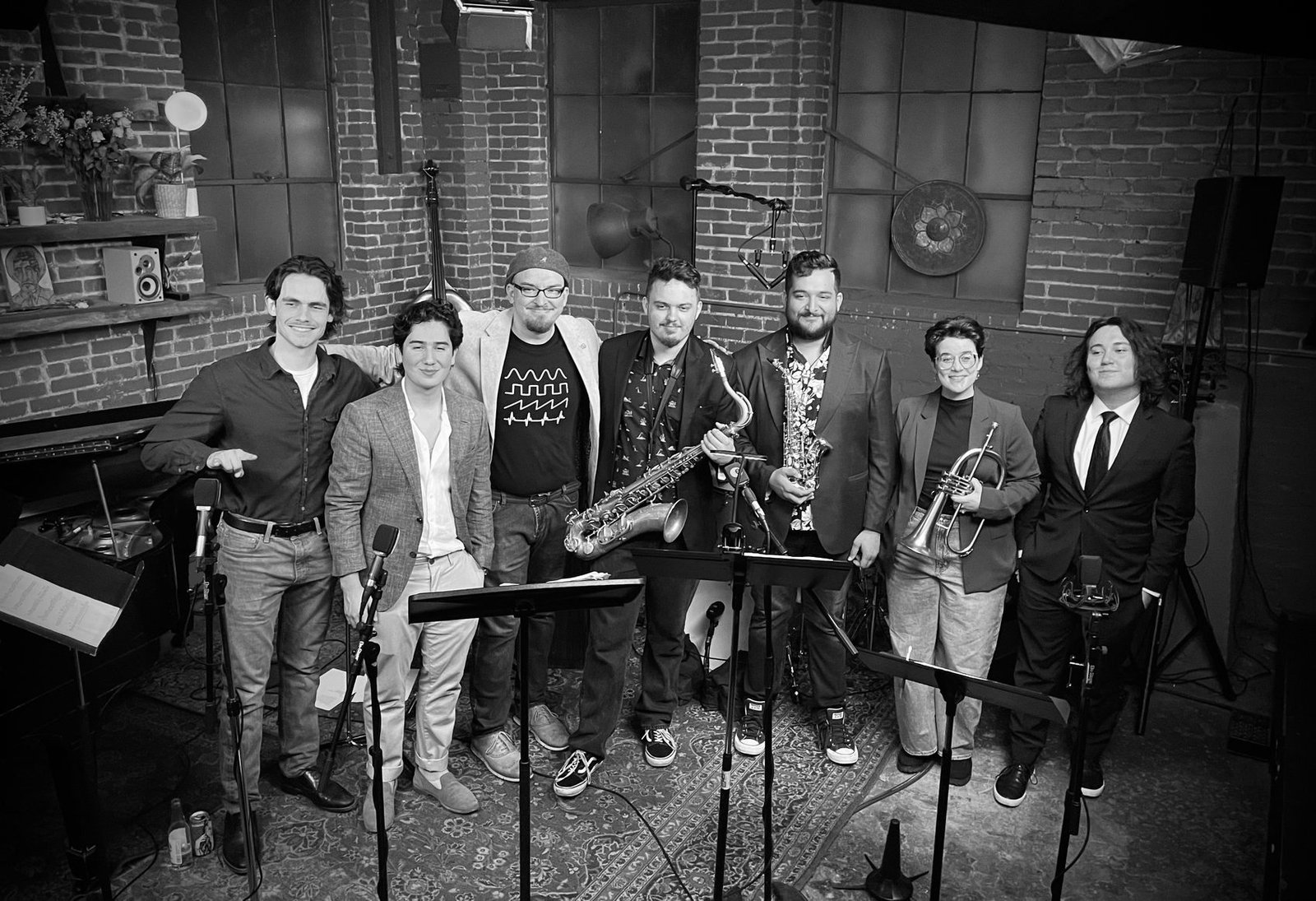 Finn Dickens at the keys with a big band jazz ensemble on stage